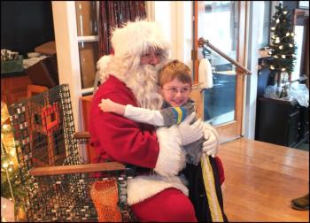 Lots of love for Santa on Sunday morning in Rockland. (Photo by Chris Wolf)