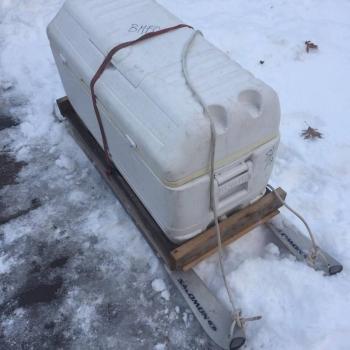 The jury-rigged Igloo cooler upon a pair of old skis does the trick in getting the food up there. (Photo courtesy Brian Beggarly)