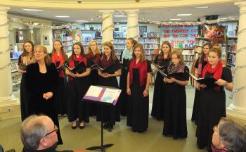 Camden Hills Regional High School’s All Girls Choir perform at Camden Public Library Dec. 2. (Photo by Chris Wolf)