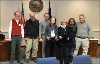 Rockland City Council members present commendations for work on the Edna St. Vincent Millay House. From left, councilors Laryy Pritchett and Ed Glaser, Mayor Will Clayton, Michelle Gifford and Ann Morris, and councilors Valli Geiger and Adam Ackor. (Photo by Chris Wolf)