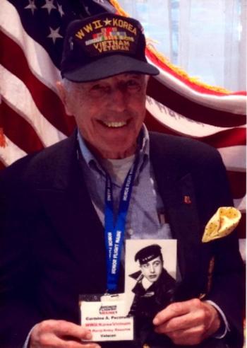Carmine Pecorelli holds a picture of his young self. (Photo courtesy of Carmine Pecorelli)