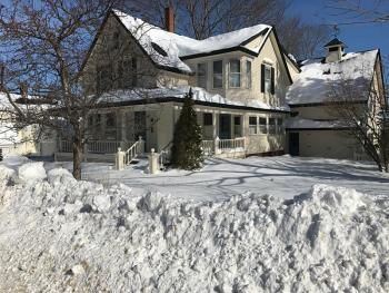 Plow drivers had their work cut out for them Tuesday pushing back packed, high snow at the ends of driveways. (Photo by Holly S. Edwards)