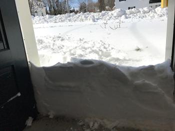 Many people opened their doors to this scene, with some taking to social media to post photos of even higher walls of snow they had to shovel from the inside to get out. (Photo by Holly S. Edwards)