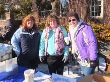 Maine Coast Orthodontics Joyce Edgecombe, Tammy Pierpont and Lisa Collins help with the food.