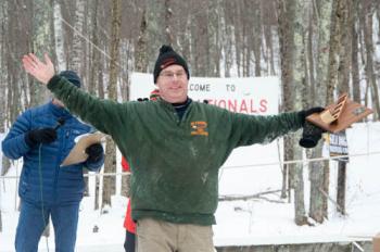 Bruce Richards, of Three Big Kahoonas, picks up his team’s trophy for 2nd place in the 3-Person division. (Photo by Marisa Hanning)