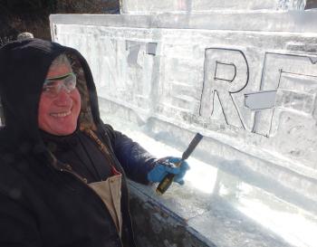 Pietera Santa works on the Winterfest sign.