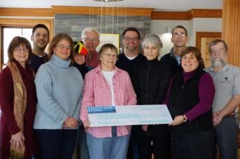 Businesses involved in the 13th Annual Pies on Parade Tour gathered on Wednesday, February 8, 2017 to deliver a check to the AIO Food Pantry. Included in the check presentation were the following people: Cyndi Ostrowski (Inns at Blackberry Common), PJ Walter (LimeRock Inn), Joan Lemole (The Penobscot Language School), Carney Doucette (Maine Coastal Island National Wildlife Refuge), Ted Weiss (Hawthorn Inn), Marty Shaw (AIO Food Pantry), Charlie Page (Maritime Energy), Jean Thompson (CMCA), Chris Seavey (Maritime Energy), Cheryl Michaelsen (Berry Manor Inn), Edwin Hantz (Granite Inn). (Photo courtesy PJ Walter/PJ Walter Photography)