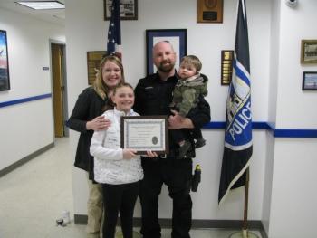 Officer Andrew Redden’s family joins him at the station for his award presentation. (Photo courtesy of Rockland Police Department)
