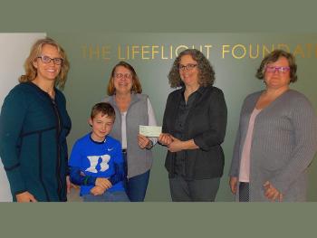Pictured at the check presentation, from left, are LifeFlight Events Coordinator Shannon Thompson, LifeFlight Patient Carter Duke, Camden Lions Club Membership Chair (and grandmother to Carter Duke) Bette Stone, LifeFlight Director of Communications Melissa Arndt and LifeFlight Development Assistant Christine deLorimier. The donation will help purchase night vision goggles for LifeFlight's third base of operations in Sanford.
