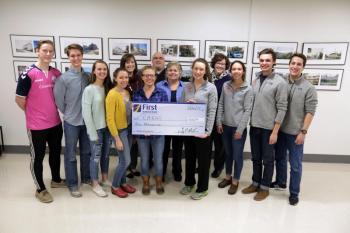 Accepting the $1,000 donation from First National Bank are, front row, left to right: Nordic Team Captains Maddison Jordan, Marley O’Neil, Erin Dowd, Emily Bowen, Lucy Hayward; Cross Country Team Captains Emma Trapani, Mallory Caron, Caleb Love-Webb, Nick Doran. From First National Bank in the back row from left to right: Angie Parent, Branch Supervisor in Rockport, Jake Miller, VP Business Development Officer Knox County, Angie Sabins, Assistant Manager in Camden, and Jennifer Stewart, Senior Vice President, Retail Lending.