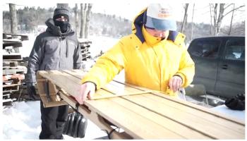 ‘Almost 84-year-old’ Toboggan Nationals Committee member Bob Annis measures a toboggan at the inspection table.