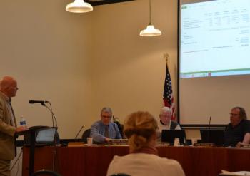 Rod Smith, of Smith and Co., delivers his Ragged Mountain Redevelopment audit report to to the Camden Select Board April 18.