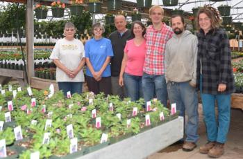The Guini Ridge Farm crew is ready to open in Rockport, at the former Hoboken Gardens greenhouse and nursery spot, on Route 1, near the intersection of Pascal Ave. The crew in the photo consists of Nancy Barker; Mary Heckman, Wendy, Bruce and Daniel Reinemann; Paul Kraemer and Trina DiMarzo. (Photo by Lynda Clancy)