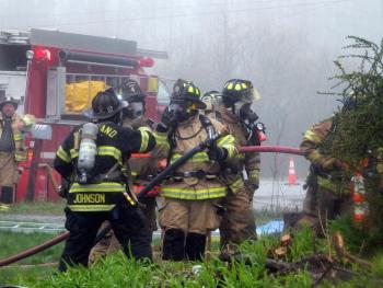 Firefighters participating in training sessions leave no centimeter of skin exposed. (Photo by Sarah Thompson)
