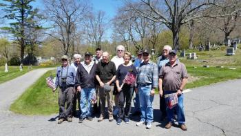 Members of American Legion War Memorial Post 30 and volunteers placed flags and memorial markers on veteran graves at the Mountain View Cemetery in preparation for the Memorial Day holiday, May 29. Front row from left, Norman Carver, Frank Carr, Geoff Chapman, Dolores Hyssong, John Hyssong and Jim Hyssong. Back row from left, Phil Harris, Rosey Gerry, Jeff Sukeforth, Kip Stinson and Cecil Dennison. (Photo by Sarah Shepherd)