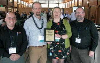 Marian Chioffi and Chris Smith of the Monhegan Plantation Power District (center) were joined by representatives of Innovative Construction & Design Solutions, LLC after receiving the Island Energy Innovation Award at the 2017 Island Energy Conference in South Portland on April 28. (Pictured L-R: Dan Fisher, ICDS; Chris Smith; Marian Chioffi; and Scott Fitch, ICDS)
