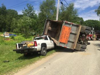 A dump truck rolled over and landed on top of the front end of a Chevrolet pickup truck on Vinal Street in Rockport July 11. (Photo courtesy of Rockport Fire Department)