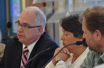 Attorney William Stockmeyer, of the Portland-based firm Drummond Woodsum, sits with School Administrative District 28 Superintendent Maria Libby and board Chairman Matt Dailey, July 13, in the Camden-Rockport Middle School cafeteria for a special meeting about the future of Mary E. Taylor school. (Photo by Lynda Clancy)