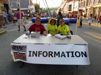 Left to right: Linda Earls, Linda Garson Smith, and Debbie Murphy man the High Street information table.