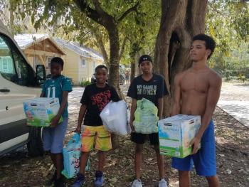 There was plenty of help to unload the supplies from Nathaniel Bernier’s truck.