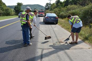 Rockport firefighters clean up the accident scene. (Photo by Royan Bartley/Rockport Fire Department)
