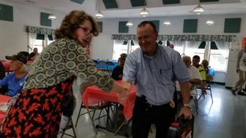Camden Police Detective was another happy raffle winner. (Photo by Sarah Shepherd0