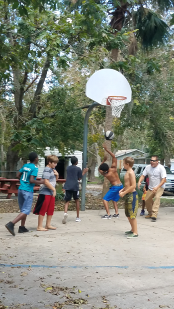 There was time to enjoy a pickup game up basketball with the teenage boys at The Homeless Coalition.