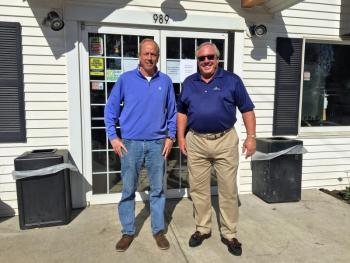 Russ Armstrong, in charge of the restoration at the new Boothbay Village Market, left, and Paul Coulombe, stand in front of the building. SUZI THAYER/Boothbay Register