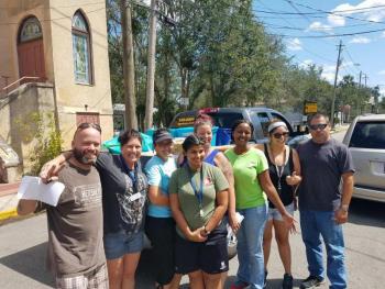 Some of the residents at the St. Francis House, a shelter, in St. Augustine, Florida, greet Nathaniel Bernier (far left), of Lincolnville, and Juan Alcala, of Rockport (far right), after their arrival with a truck full of supplies and tree removal gear to support many in St. John’s County who were affected by Hurricane Irma. (All photos by Nathaniel Bernier and Juan Alcala)