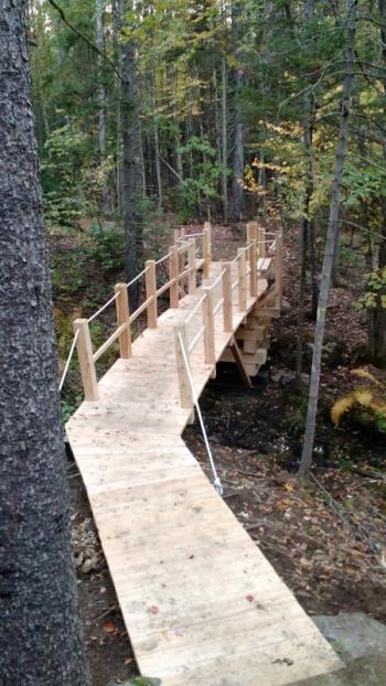 Bob White helped to build a footbridge on the Connector Trail.