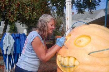 Gina Philippon carves on a pumpkin that will have a built-in fountain. ART MAYERS/Boothbay Register