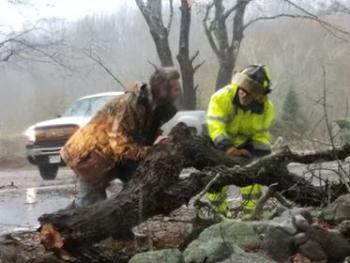 Union Fire Police Jim Murphy, Jr., and a good Samaritan pushing aside a tree on Route 235/Depot Street, Union. Tammy Davis got this photo of crews working Appleton while she was traveling Depot Street through Route 235 to Waldoboro. (Photo courtesy Tammy Davis)