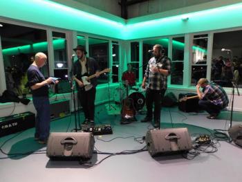 The band, Chris Ross and the North, prepares to play. (photo by Erica Thoms)