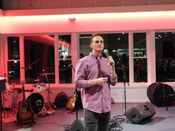 Colby Horne reads raffle ticket numbers. (photo by Erica Thoms)