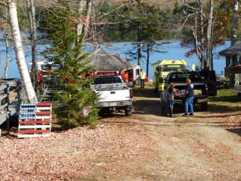 Fire crew on Half Moon Pond access the fire by boat. (photo by Erica Thoms)