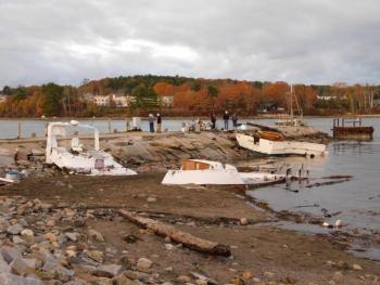 Pieces of a boat broken in the storm sit near Belfast’s downtown boat launch. (photo by Erica Thoms)
