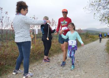 Runners and walkers took to the hills of Rockport Saturday morning, earning handmade medals for completing the first-ever Beach to Beech 5K up the new Connector Trail. (Photo by Lynda Clancy)