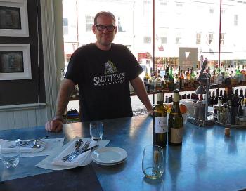 Chef and Owner Evan Mallett behind Ondine’s bar. (photo by Erica Thoms)