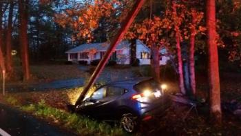 Old County Road in Rockport on Nov. 6, around 4:25 p.m., was the scene of a vehicle that had gone off the road into a ditch, striking a utility pole causing downed wires. (Photo by Sarah Shepherd)