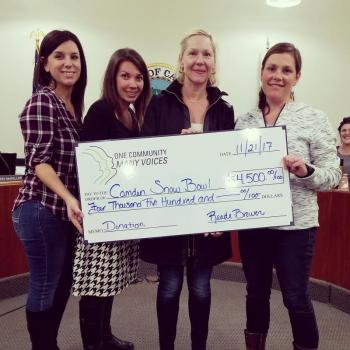 Members of One Community Many Voices and organizers of the Ragged Mountain Scuttle presented $4,500 to the Camden Snow Bowl on Nov. 21. Pictured, from left, are Kelly Woods and Audrey Lovering of OCMV and the Scuttle Committee, Diana Castle with the Scuttle Committee and Beth Ward with the Scuttle Committee and the Camden Snow Bowl.