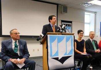 Peter DelGreco (center), CEO of Maine & Company speaks to the crowd. Governor Paul LePage (far left), Mayor Samantha Paradis (second from right) and Belfast City Council member Eric Sanders.
(photo by Erica Thoms)