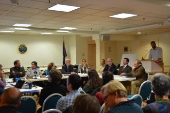 The SAD 28 School Board, as well as superintendent, attorneys and architects, listens to Michael Mullins present his proposal Jan. 10 at the Rockport Opera House. (Photo by Lynda Clancy)