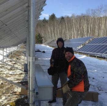 ReVision Energy’s Justin Milliken (L) and Andrew Lesko put finishing touches on Camden’s new solar array. (Photo courtesy ReVision Energy)