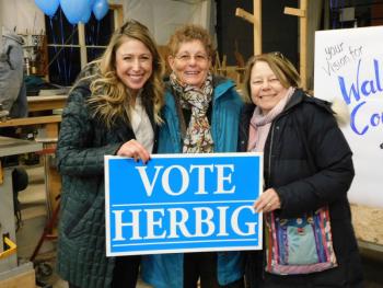 House Majority Leader Erin Herbig, D-Belfast, stands with two supporters -
Sharon Goguen, of Belfast, (center) and Diana Hauser, of Unity (right).
(Photo by Erica Thoms)