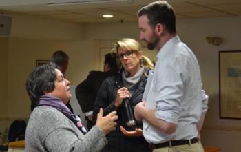 School Administrative District 28 Superintendent Maria Libby, board member Elizabeth Noble, of Camden, and Michael Mullins speak after the Jan. 10 meeting concludes. (Photo by Lynda Clancy)