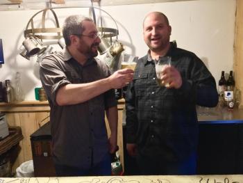 Dan Pangburn, left, toasts his best friend and Footbridge Brewery partner, Nick Ulo. SUZI THAYER/Boothbay Register