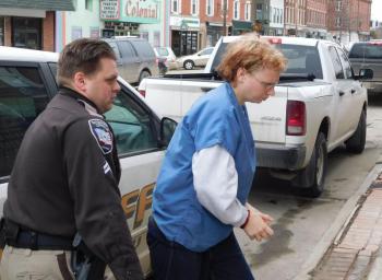 Sharon Carrillo looks down as she is led into Waldo County Superior Court. (photo by Erica Thoms)