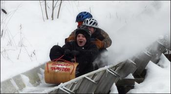 A toboggan crew takes a practice run down the chute.