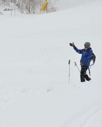 Mike puts his skis back on for his third hike back up to the top of Ragged Mountain to ski down.