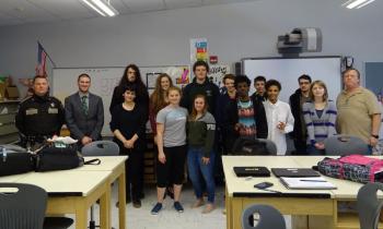 Waldo County Sheriff School Resource Officer Deputy Jordan Tozier stands far left with Mount View Principal Zackary Freeman to the immediate right. Students in the Advanced Art class stand between Freeman and Eric Phillips, far right, who teaches the class. (Photo by Erica Thoms)
